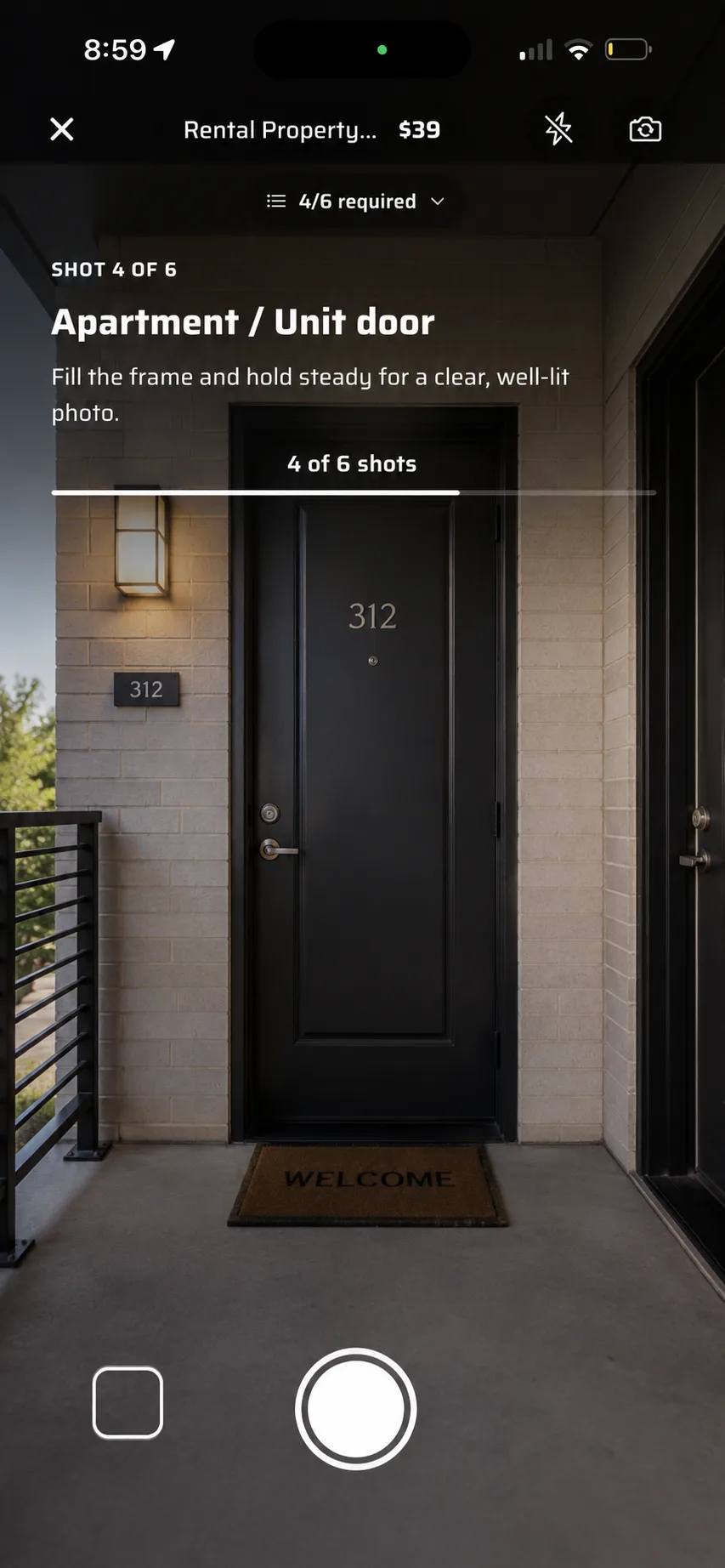 The in-app camera on shot 4 of 6, captioned Unit door.